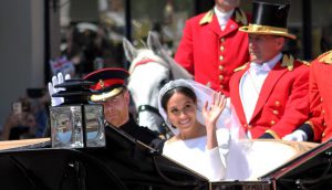 The Royal Wedding of Prince Harry and Meghan Markle Duke and Duchess of Sussex - Driving in the carriage through Windsor waving at crowds